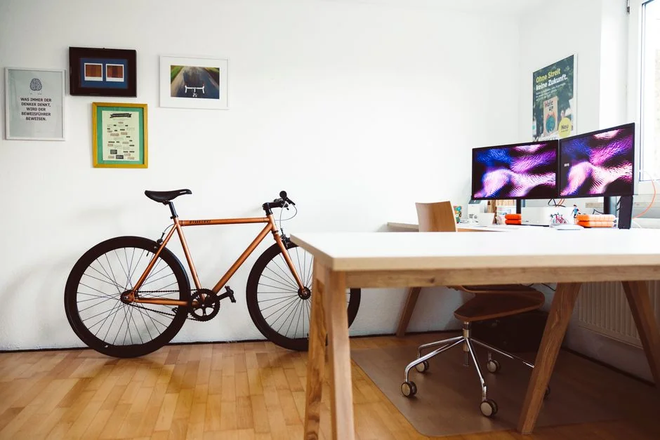 A modern computer screen displaying web design work, showcasing creative visuals in a workspace.